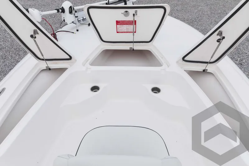 Slide: The Image of 2023 Tidewater 1910 Bay Max boat with open storage compartments. - 18