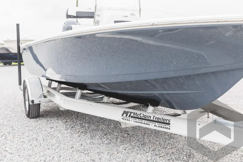 Slide: The Image of 2023 Tidewater 1910 Bay Max boat on McClain trailer, side view. - 2