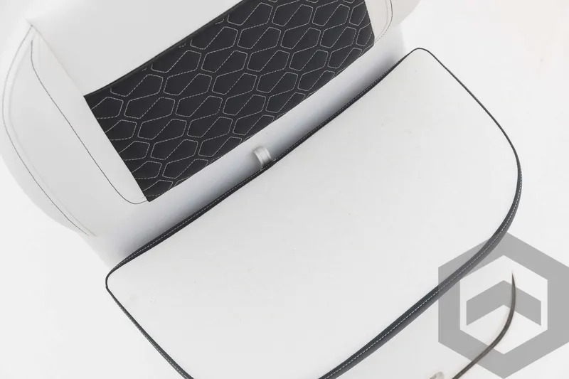 Slide: The Image of 2023 Tidewater 1910 Bay Max boat seat with black and white upholstery. - 25