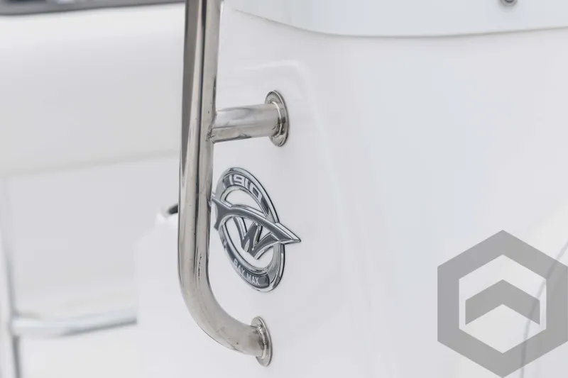 Slide: The Image of 2023 Tidewater 1910 Bay Max boat emblem and stainless steel handle. - 28