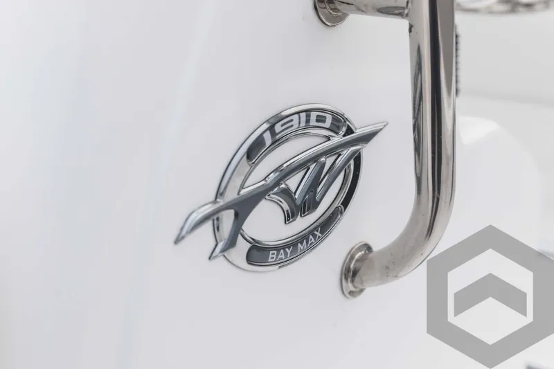 Slide: The Image of 2023 Tidewater 1910 Bay Max logo on white boat hull. - 31