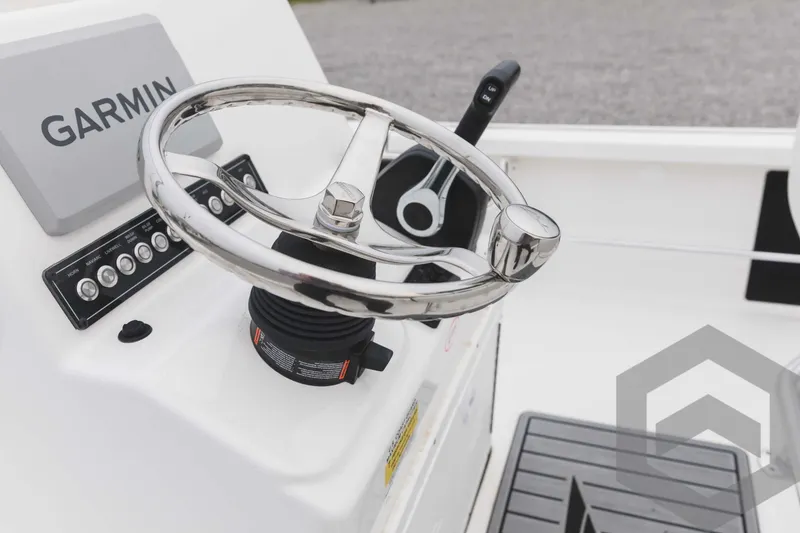 Slide: The Image of Steering console of 2023 Tidewater 1910 Bay Max boat with Garmin navigation system. - 34