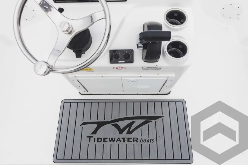 Slide: The Image of 2023 Tidewater 1910 Bay Max boat console with steering wheel and control panel. - 37