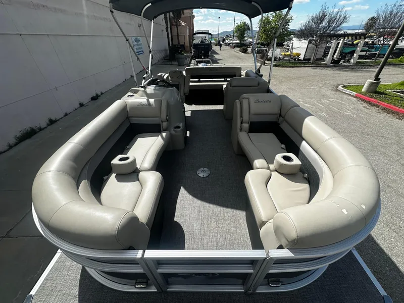 Slide: The Image of 2021 Barletta C22U pontoon boat with spacious seating and canopy. - 11