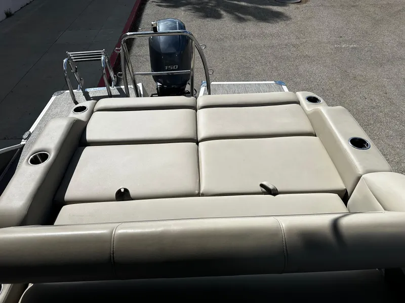 Slide: The Image of 2021 Barletta C22U boat with spacious rear seating and powerful outboard motor. - 17