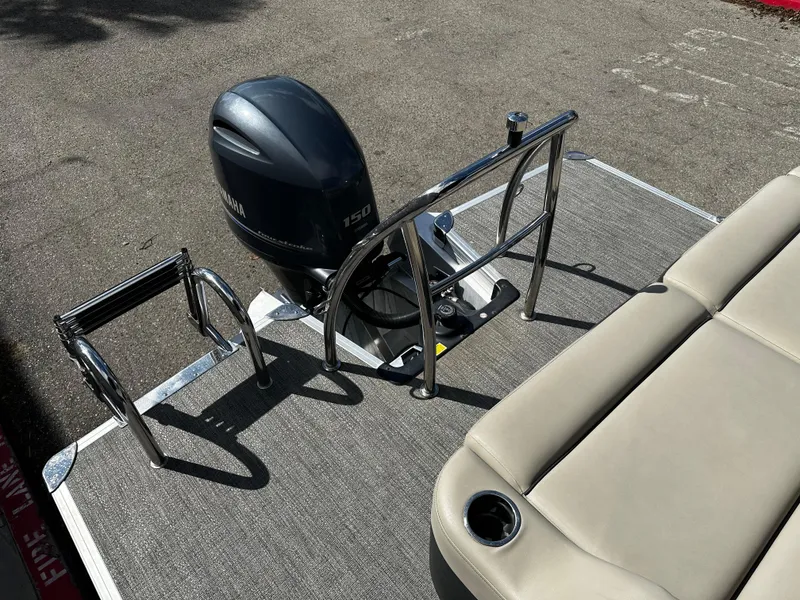 Slide: The Image of 2021 Barletta C22U pontoon boat with Yamaha 150 outboard motor and beige seating. - 18