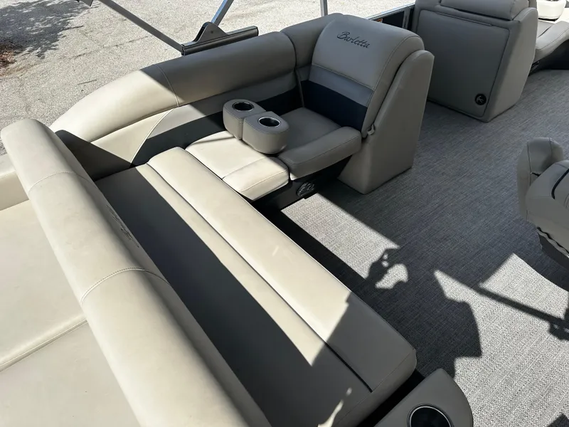 Slide: The Image of 2021 Barletta C22U boat interior with beige seating and cup holders. - 20
