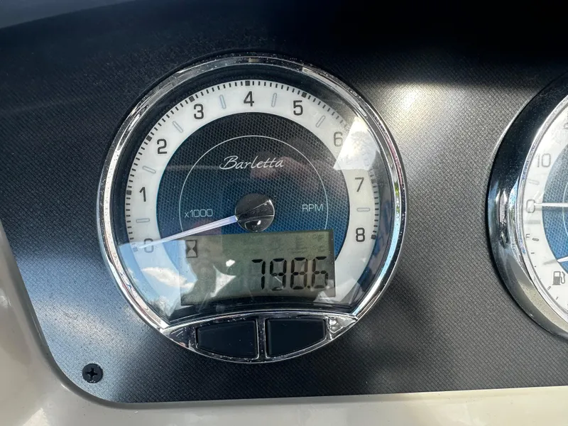 Slide: The Image of 2021 Barletta C22U boat tachometer displaying 718.6 hours. - 26