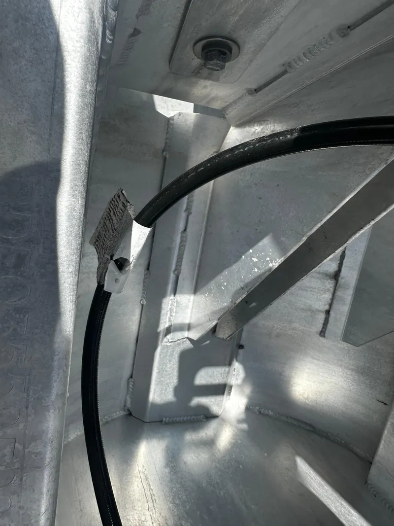 Slide: The Image of Interior view of 2021 Barletta C22U boat showing wiring and structural components. - 28