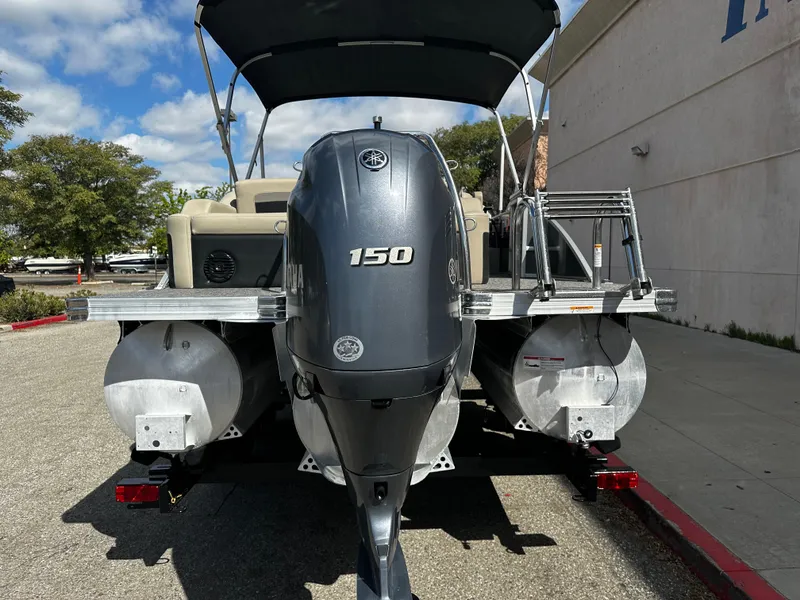 Slide: The Image of 2021 Barletta C22U pontoon boat with 150 HP engine, rear view. - 5