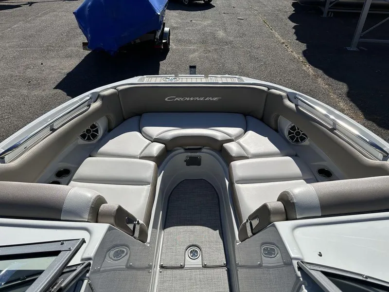 Slide: The Image of 2024 Crownline E Series E255 boat with spacious seating and modern design. - 8