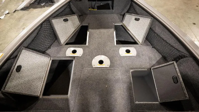 Slide: The Image of 2024 Lund 1875 Impact XS Sport boat interior storage compartments. - 10