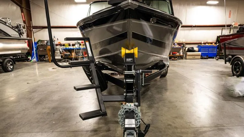 Slide: The Image of 2024 Lund 1875 Impact XS Sport boat in a workshop. - 12
