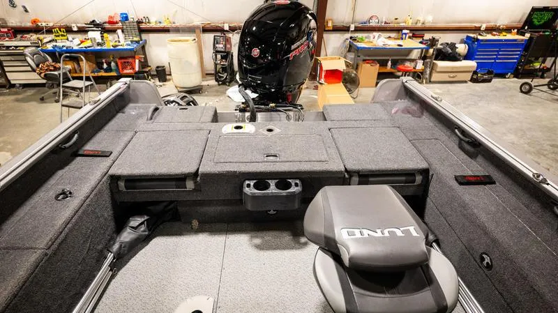 Slide: The Image of 2024 Lund 1875 Impact XS Sport boat interior in a workshop. - 15