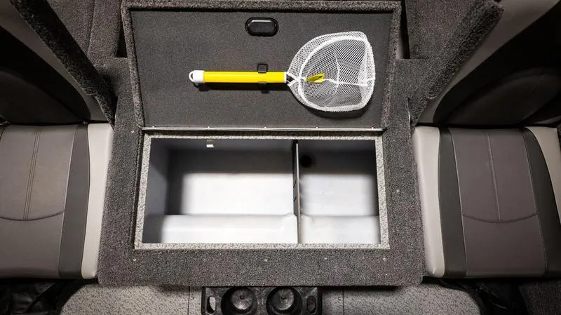 Slide: The Image of 2024 Lund 1875 Impact XS Sport boat storage compartment with a fishing net. - 17