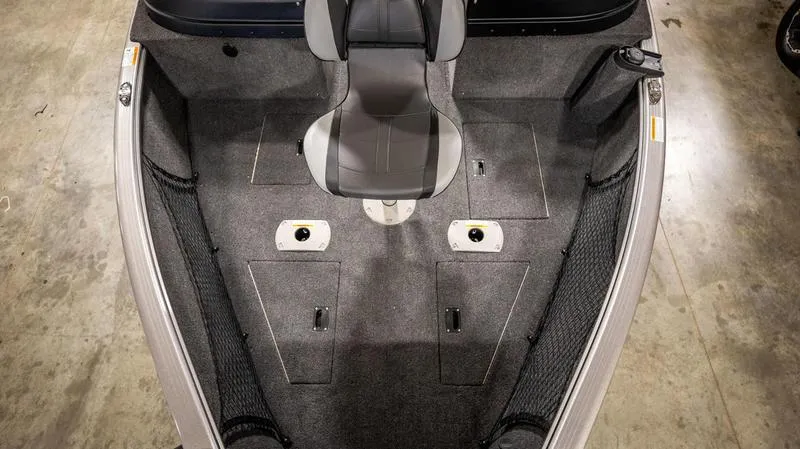 Slide: The Image of 2024 Lund 1875 Impact XS Sport boat interior, front seating and storage compartments. - 25