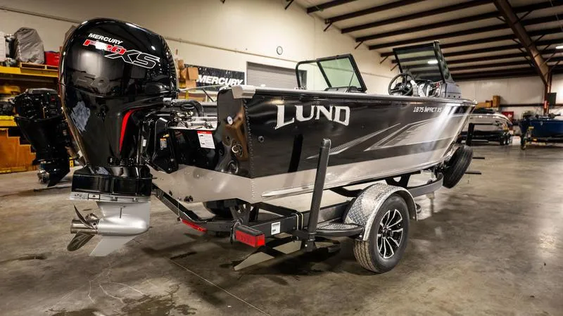 Slide: The Image of 2024 Lund 1875 Impact XS Sport boat in a warehouse. - 5