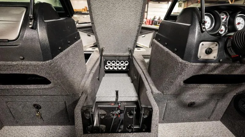 Slide: The Image of 2024 Lund 1875 Impact XS Sport interior dashboard and storage compartments. - 8