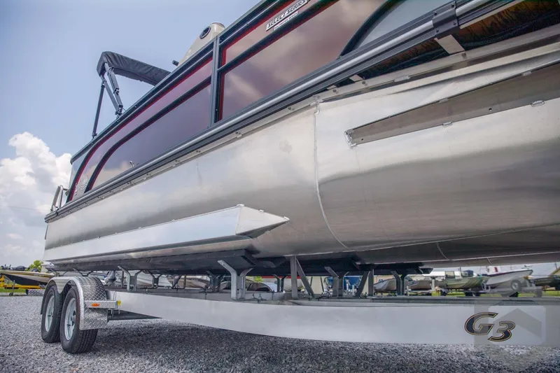 Slide: The Image of 2023 SunCatcher Select 322RC pontoon boat on a trailer, side view. - 11