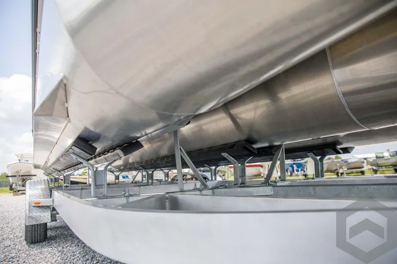 Slide: The Image of 2023 SunCatcher Select 322RC pontoon boat on a trailer, close-up view of the underside. - 12