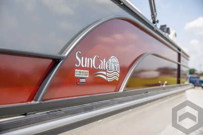 Slide: The Image of 2023 SunCatcher Select 322RC boat side view with logo. - 14