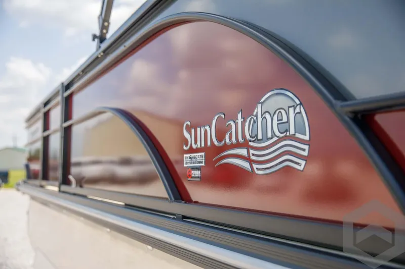 Slide: The Image of 2023 SunCatcher Select 322RC boat side view with logo. - 18