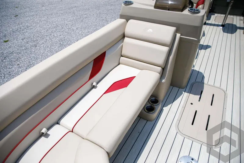 Slide: The Image of 2023 SunCatcher Select 322RC boat interior with beige and red seating. - 22
