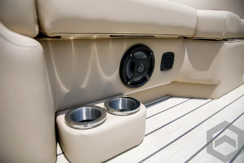 Slide: The Image of 2023 SunCatcher Select 322RC boat interior with speaker and cup holders. - 25