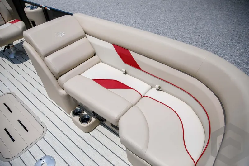 Slide: The Image of 2023 SunCatcher Select 322RC boat interior with beige and red cushioned seating. - 26
