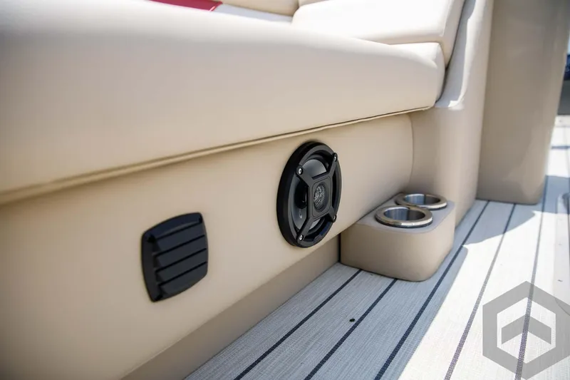 Slide: The Image of 2023 SunCatcher Select 322RC boat interior with speaker and cup holders. - 28