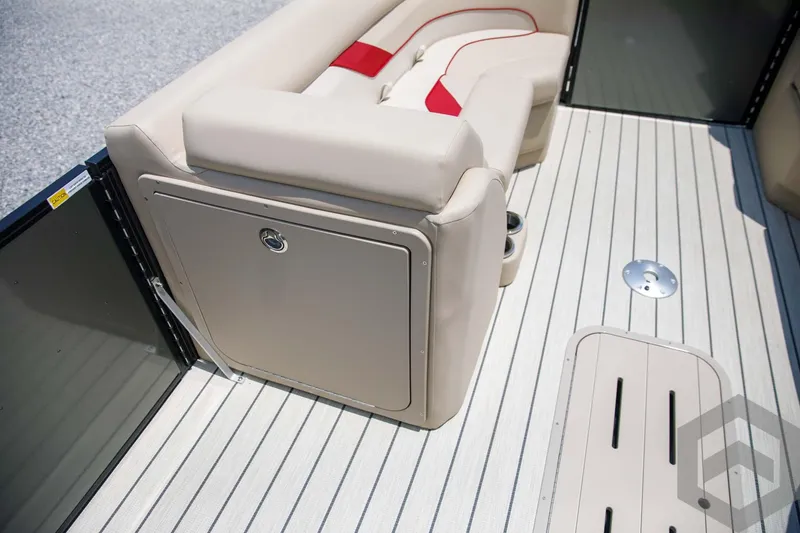 Slide: The Image of 2023 SunCatcher Select 322RC boat interior with beige seating and striped flooring. - 29