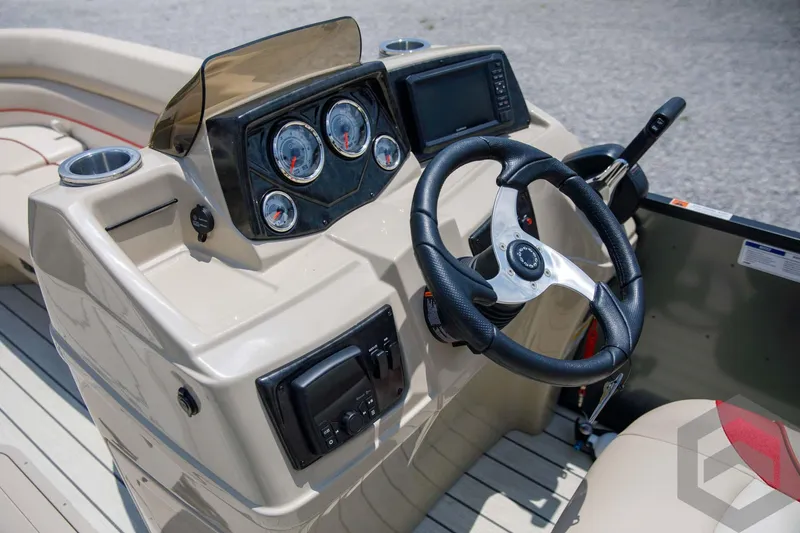 Slide: The Image of 2023 SunCatcher Select 322RC boat dashboard with steering wheel and control panel. - 31