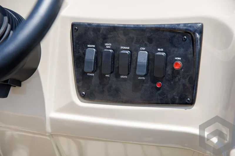 Slide: The Image of Control panel of 2023 SunCatcher Select 322RC boat with various switches and buttons. - 35