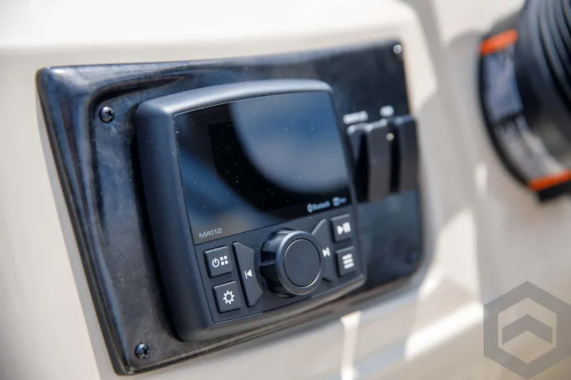 Slide: The Image of 2023 SunCatcher Select 322RC control panel with Bluetooth and navigation buttons. - 36