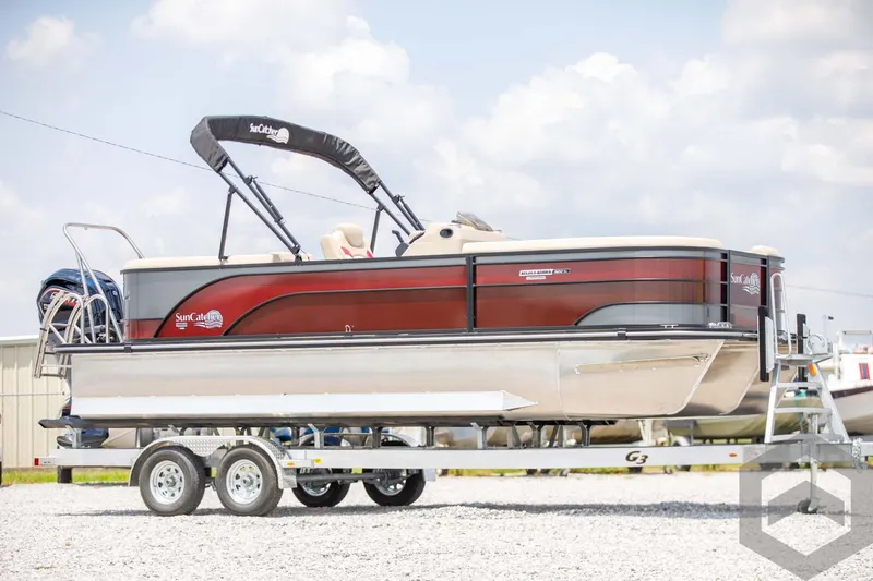 Slide: The Image of 2023 SunCatcher Select 322RC pontoon boat on a trailer, side view. - 4