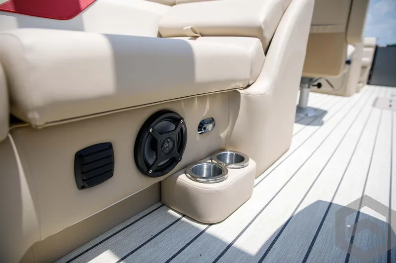 Slide: The Image of 2023 SunCatcher Select 322RC boat interior with speaker and cup holders. - 42