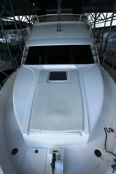 Slide: The Image of 1999 Silverton 392 Motor Yacht, front deck view under covered marina. - 14