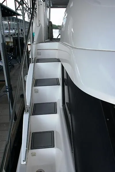Slide: The Image of Side view of 1999 Silverton 392 Motor Yacht with steps and railing. - 15