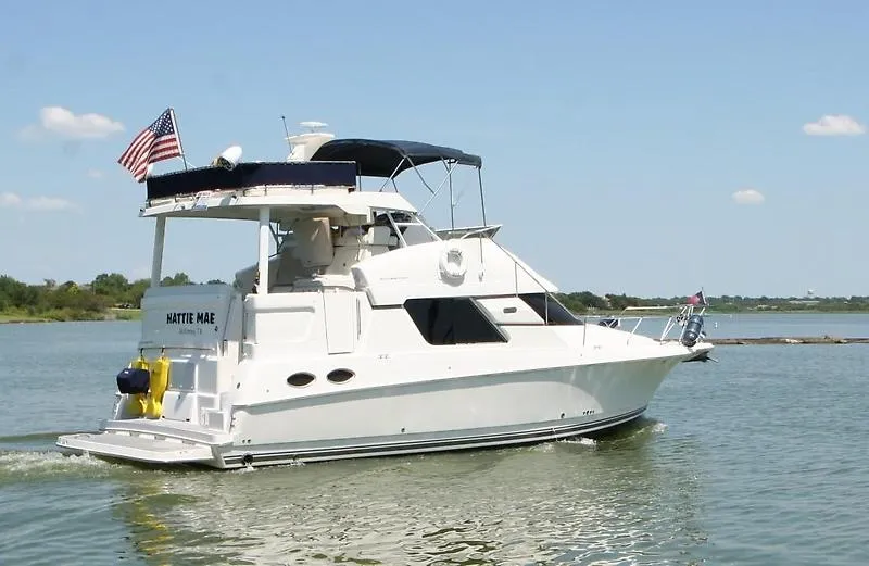 Slide: The Image of 1999 Silverton 392 Motor Yacht cruising on a calm lake. - 3