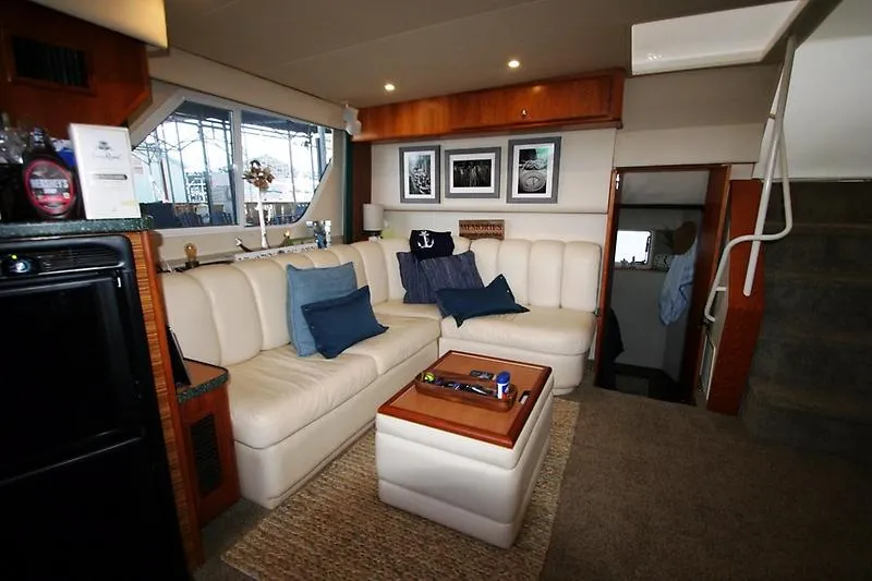 Slide: The Image of Interior of 1999 Silverton 392 Motor Yacht with white leather seating and modern decor. - 36