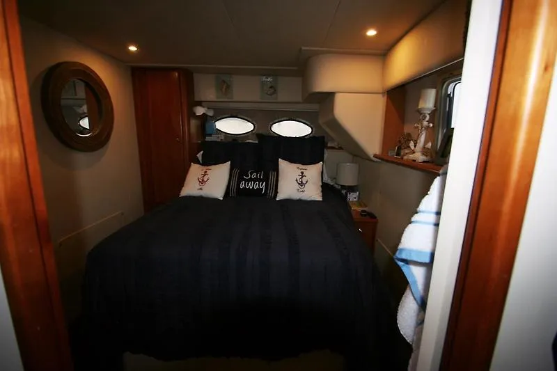 Slide: The Image of Cozy bedroom in 1999 Silverton 392 Motor Yacht with nautical decor. - 38
