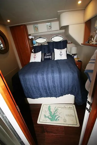 Slide: The Image of Cozy bedroom in 1999 Silverton 392 Motor Yacht with nautical decor and Sail Away pillow. - 39