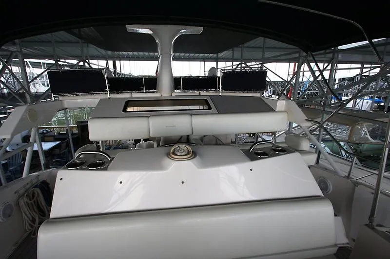 Slide: The Image of 1999 Silverton 392 Motor Yacht interior view with helm and seating area. - 6