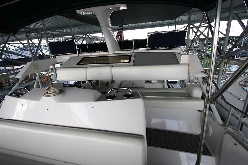 Slide: The Image of 1999 Silverton 392 Motor Yacht interior view with seating and helm station. - 9