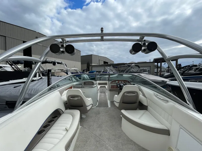 Slide: The Image of Interior of a 2005 Cobalt 240 boat with gray carpet. - 10