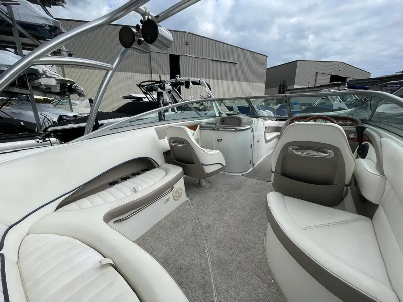 Slide: The Image of Interior of a 2005 Cobalt 240 boat with white seating. - 11
