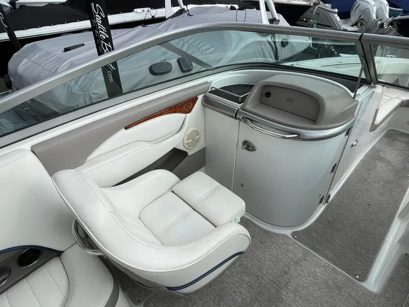 Slide: The Image of Interior of a 2005 Cobalt 240 boat with white seating. - 12