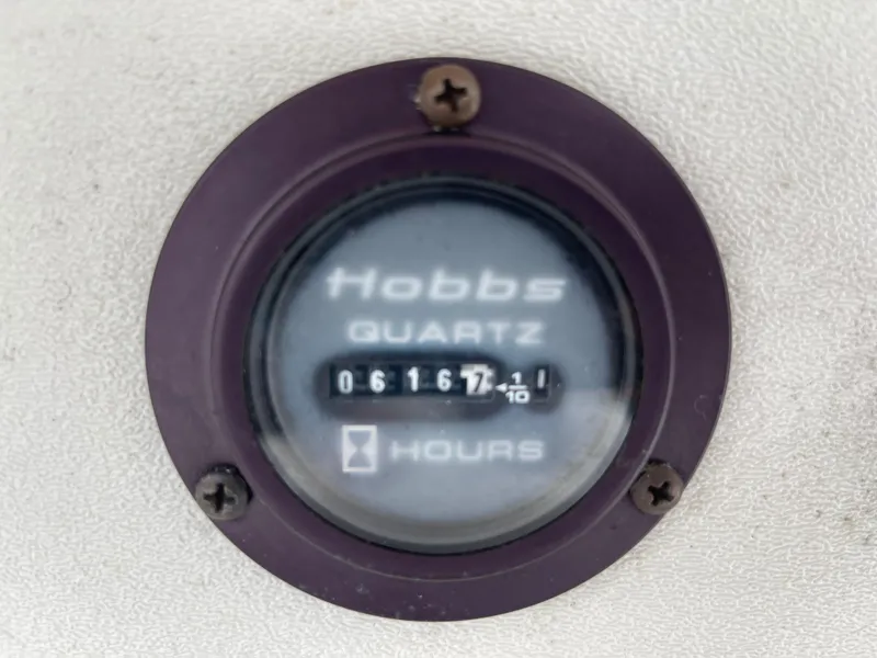 Slide: The Image of Hobbs hour meter on a 2005 Cobalt 240 boat. - 20