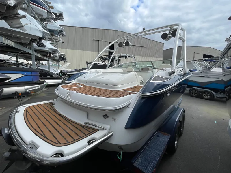 Slide: The Image of 2005 Cobalt 240 boat on trailer stored outdoors. - 6