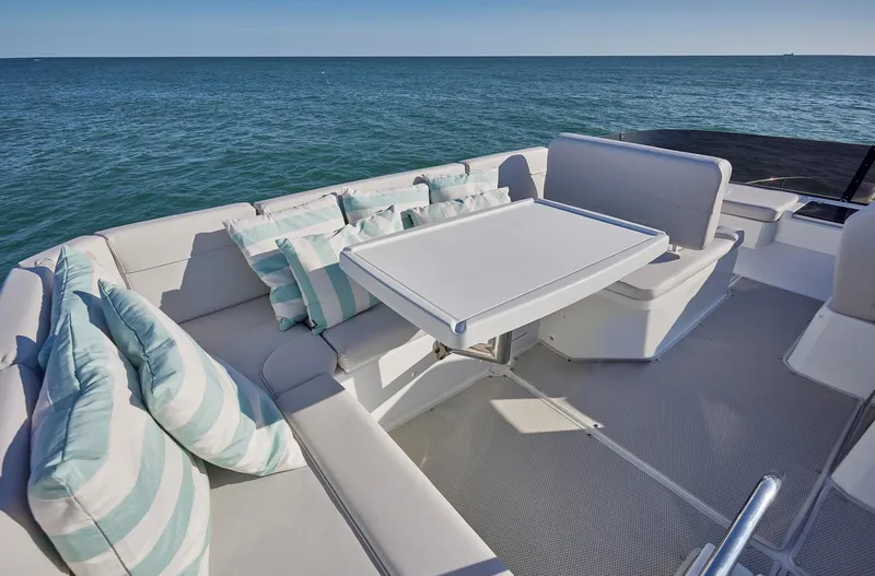 Slide: The Image of 2024 Beneteau Antares 12 yacht with elegant seating and ocean view. - 6